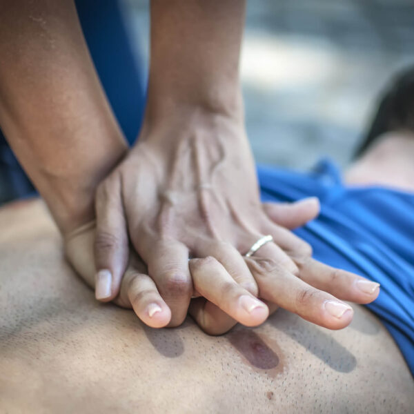 people performing CPR on health and safety courses